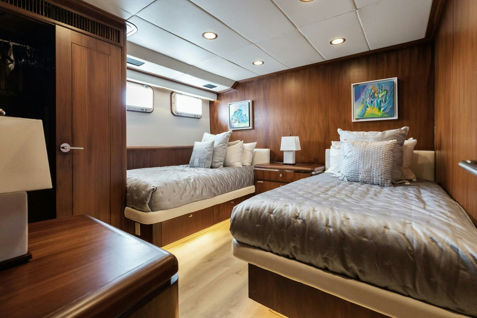 a bedroom with a bed and a desk aboard ARIES Yacht for Sale
