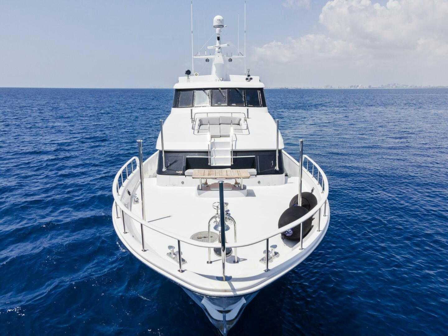 a white boat in the water aboard ARIES Yacht for Sale