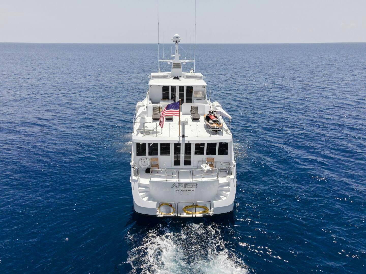 a large white boat in the water aboard ARIES Yacht for Sale
