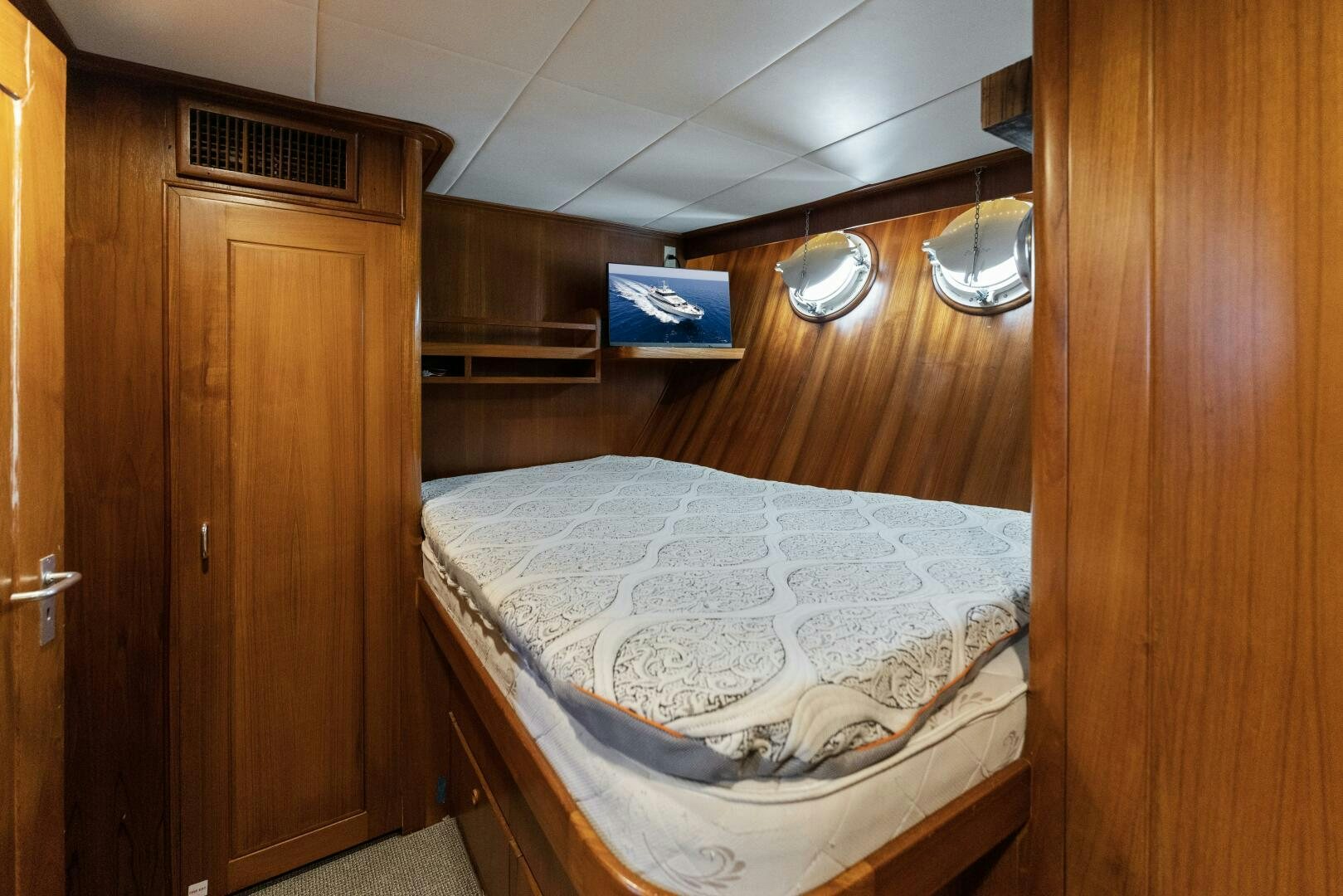 a bed in a room aboard ARIES Yacht for Sale