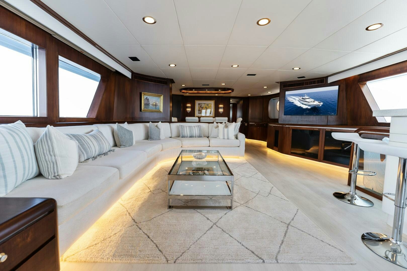 a living room with a large screen aboard ARIES Yacht for Sale
