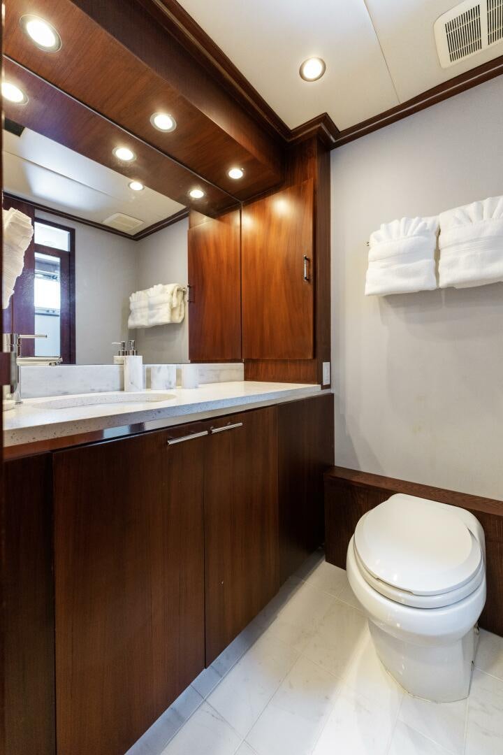 a bathroom with a toilet and a sink aboard ARIES Yacht for Sale