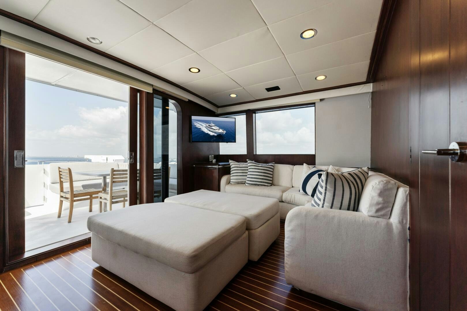 a large living room with a large window aboard ARIES Yacht for Sale