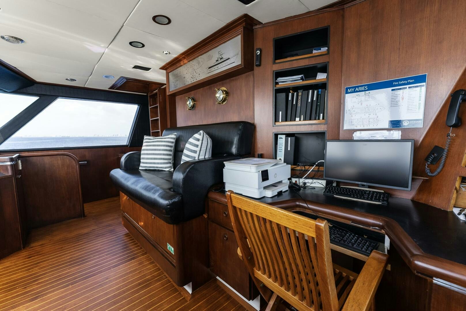 a living room with a piano and a tv aboard ARIES Yacht for Sale