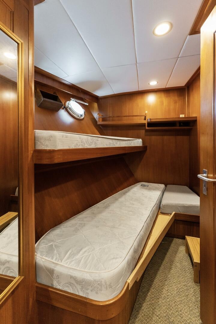 a bed in a room aboard ARIES Yacht for Sale