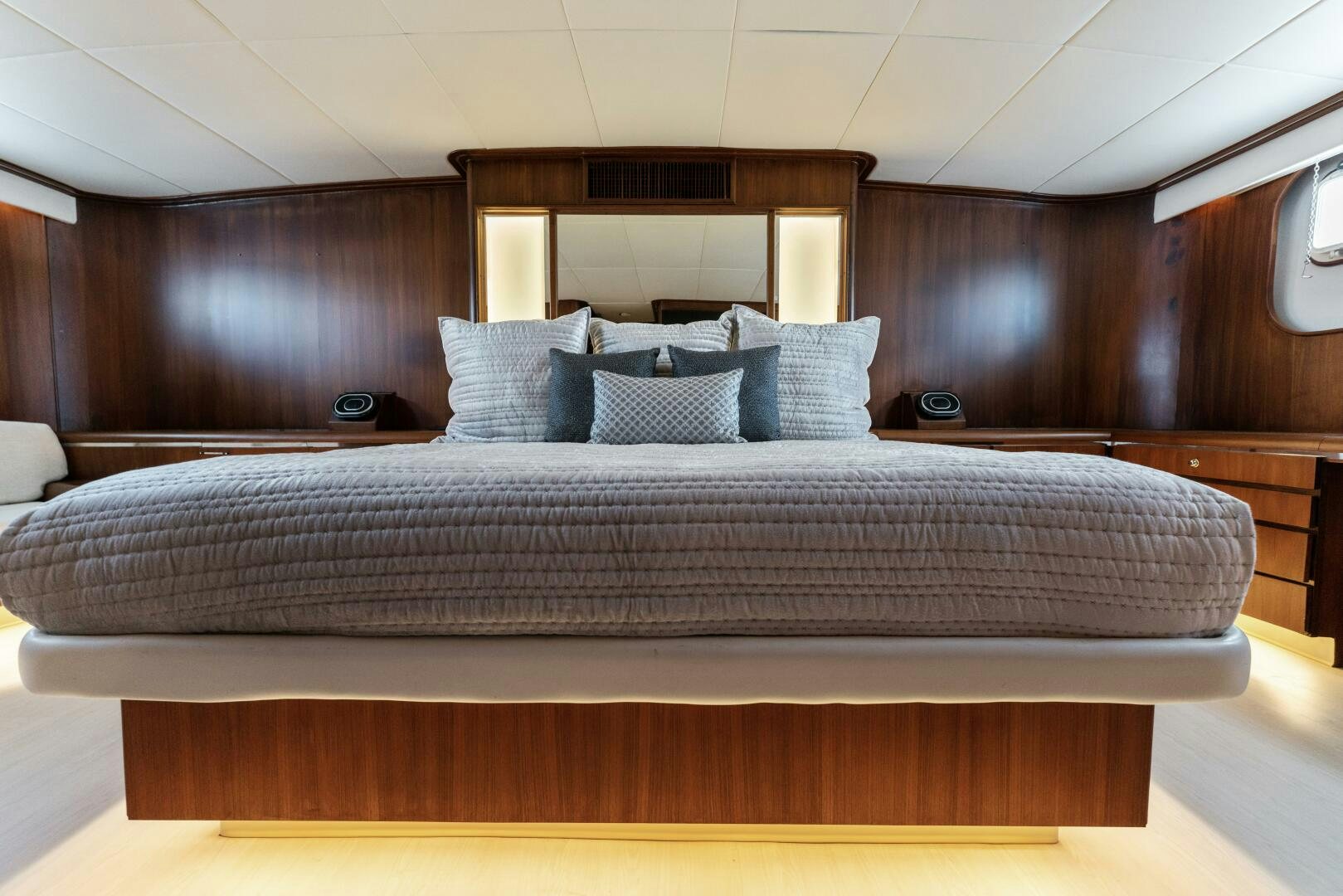 a bed with a white comforter aboard ARIES Yacht for Sale