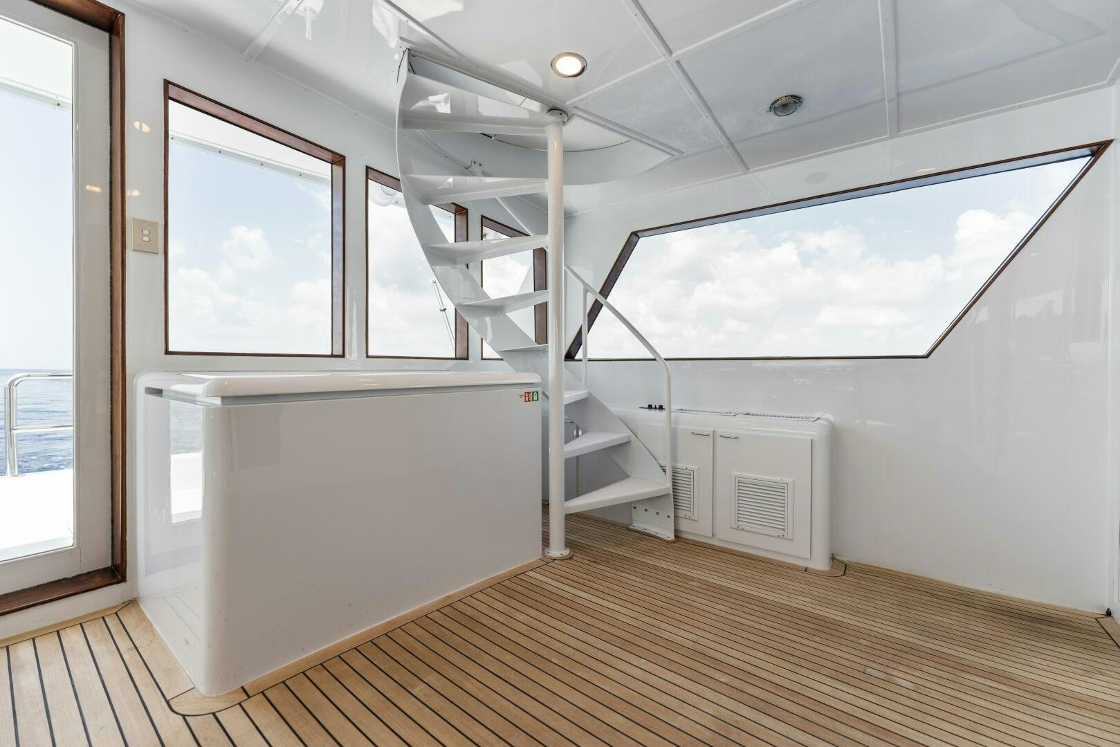 a room with a staircase and a window aboard ARIES Yacht for Sale