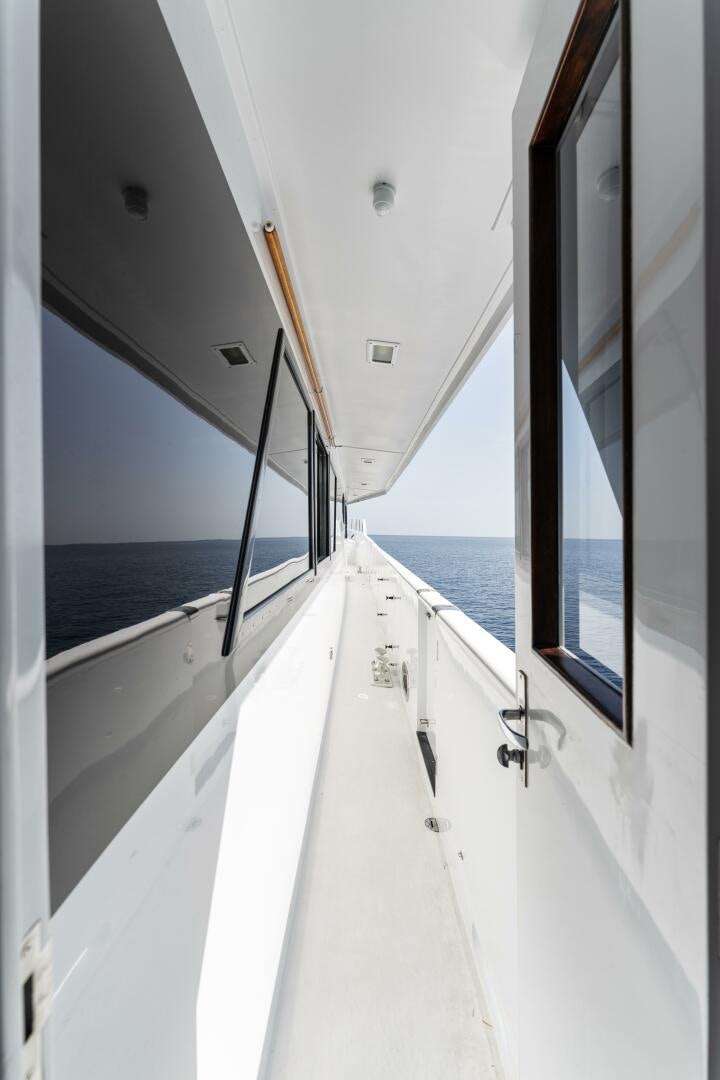 a white boat with a black pole aboard ARIES Yacht for Sale