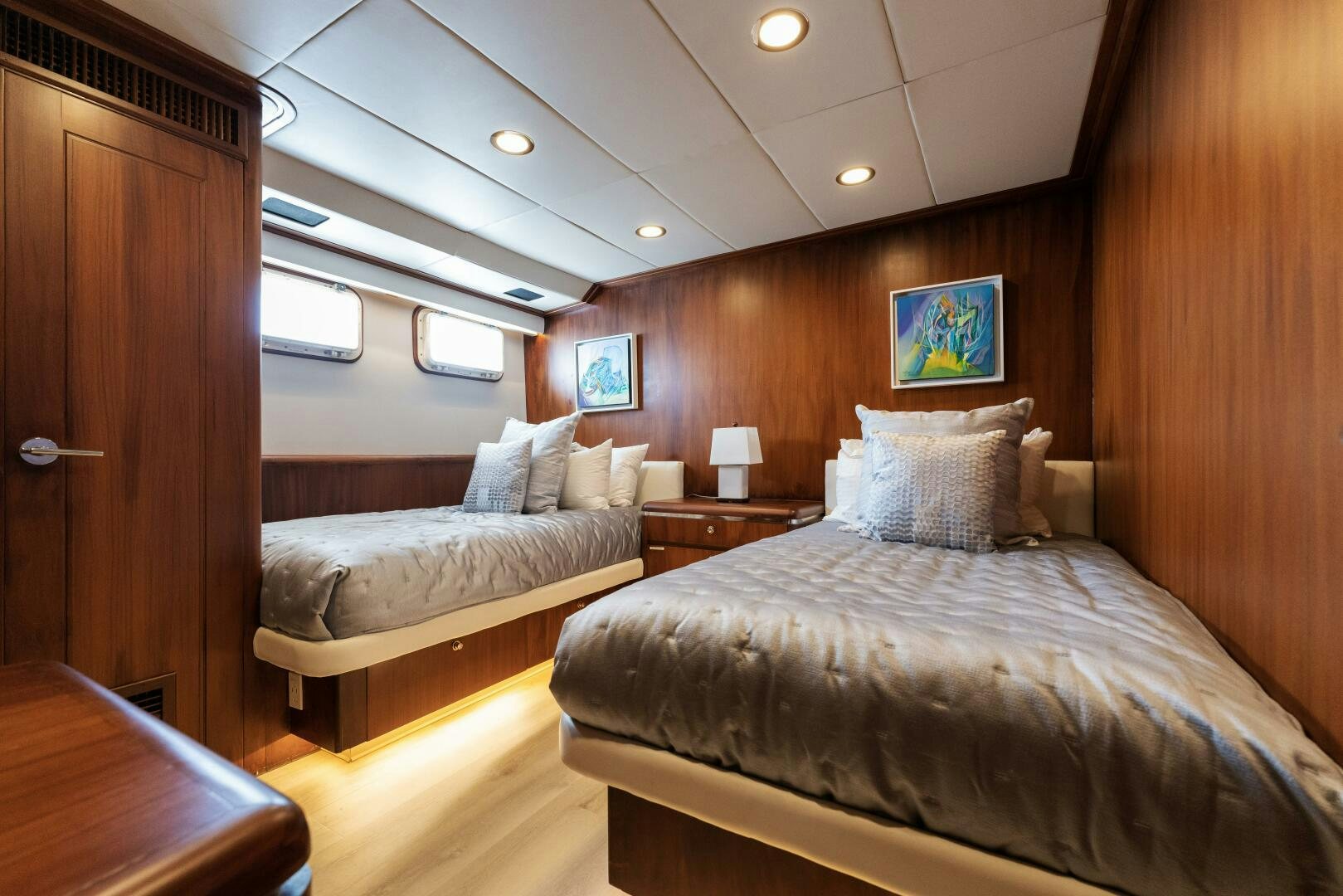 a room with a bed and a wood door aboard ARIES Yacht for Sale