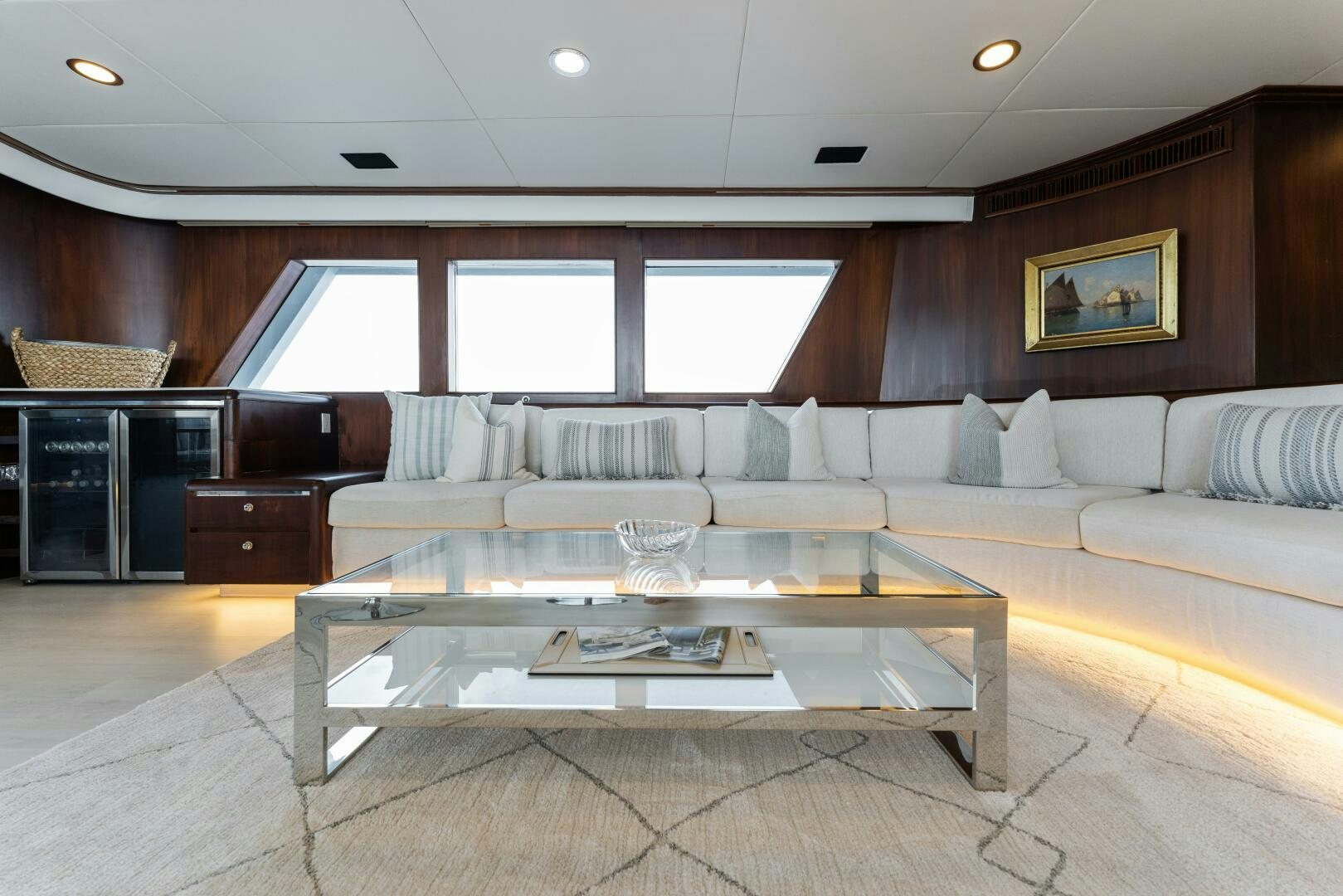 a living room with a large table aboard ARIES Yacht for Sale