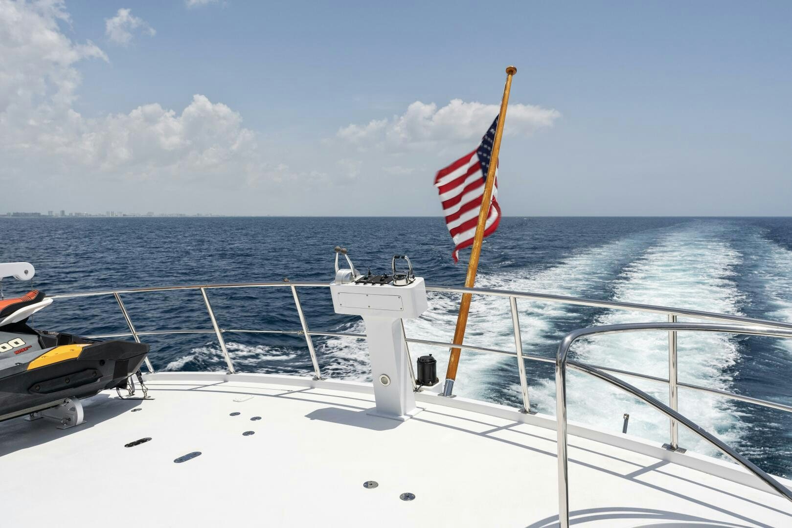 a boat with a flag on it aboard ARIES Yacht for Sale