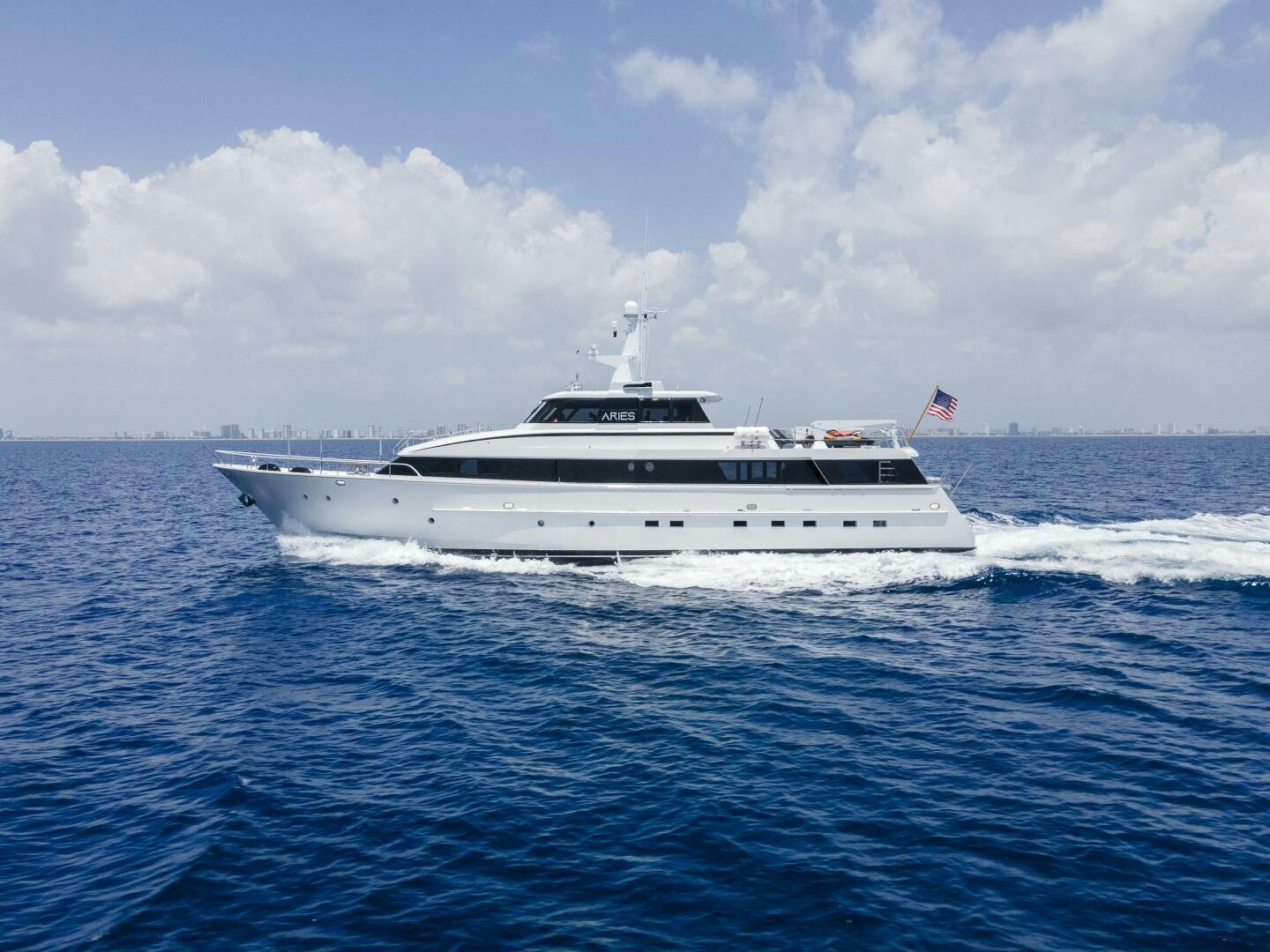 a white boat in the water aboard ARIES Yacht for Sale