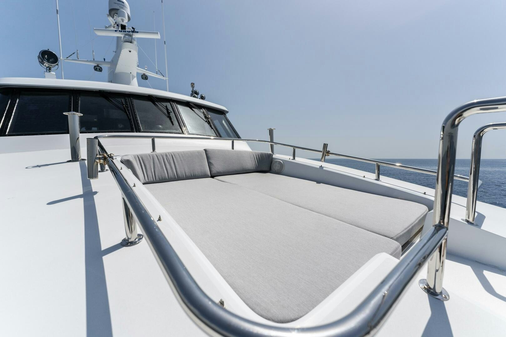 a white boat with a white sail aboard ARIES Yacht for Sale