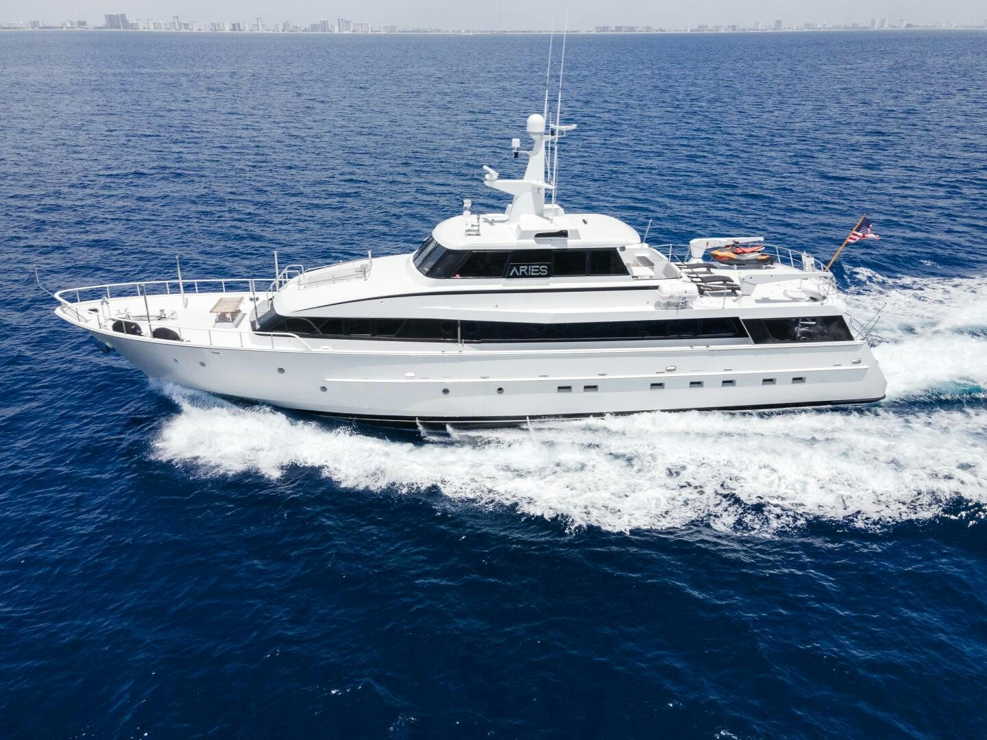 a white yacht on the water aboard ARIES Yacht for Sale