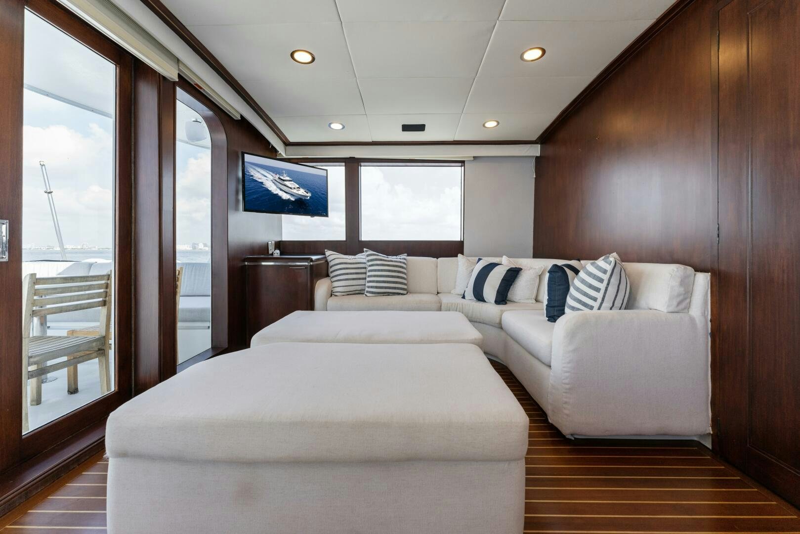 a room with a bed and a couch aboard ARIES Yacht for Sale