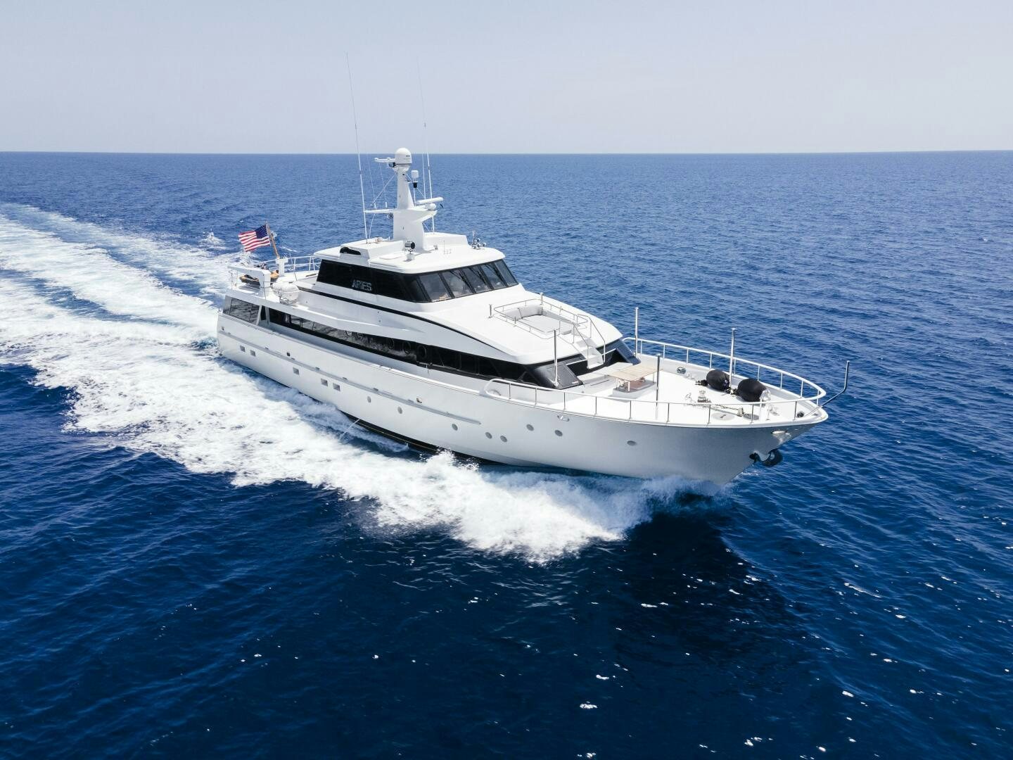 a white boat on the water aboard ARIES Yacht for Sale