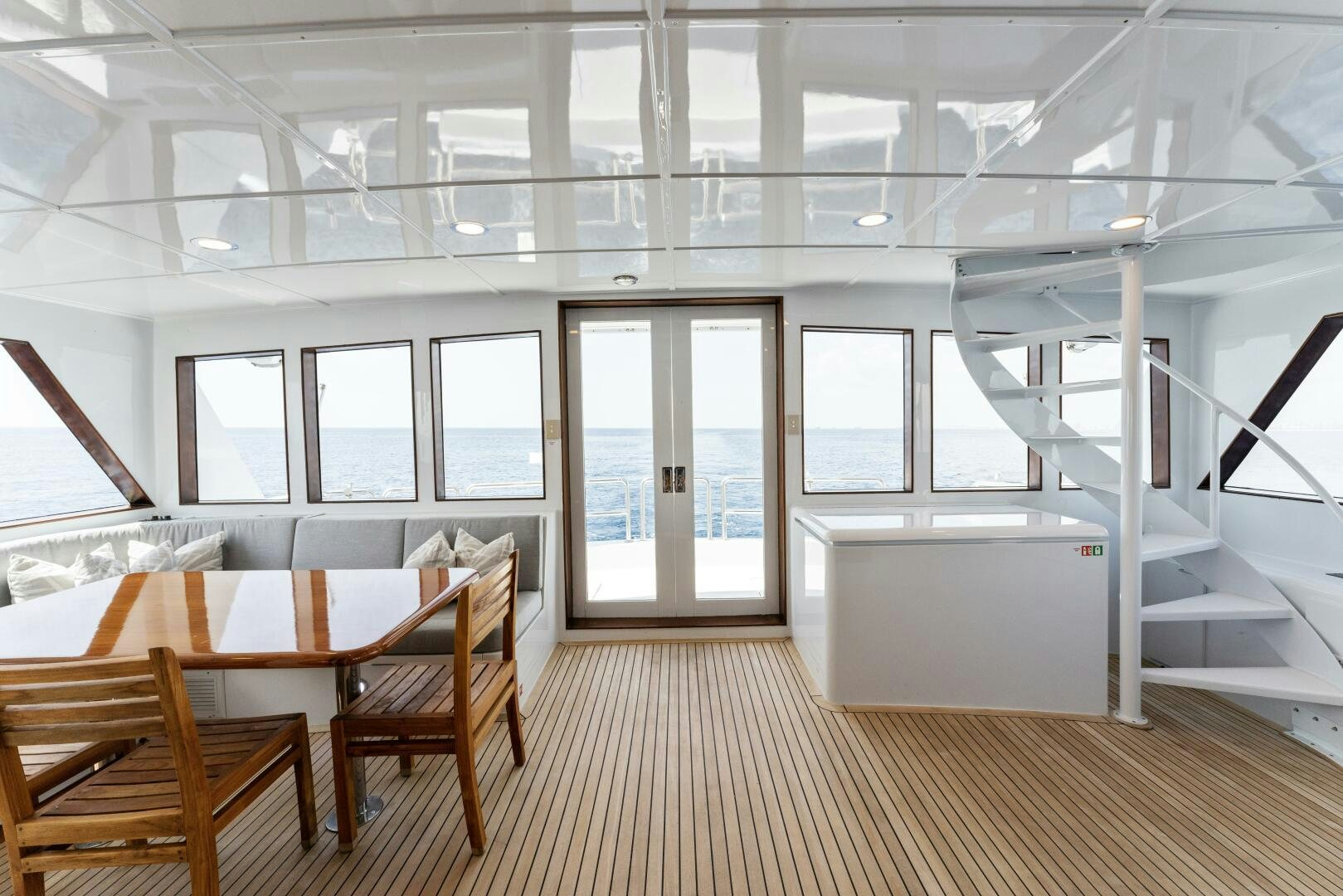 a room with a table and chairs aboard ARIES Yacht for Sale