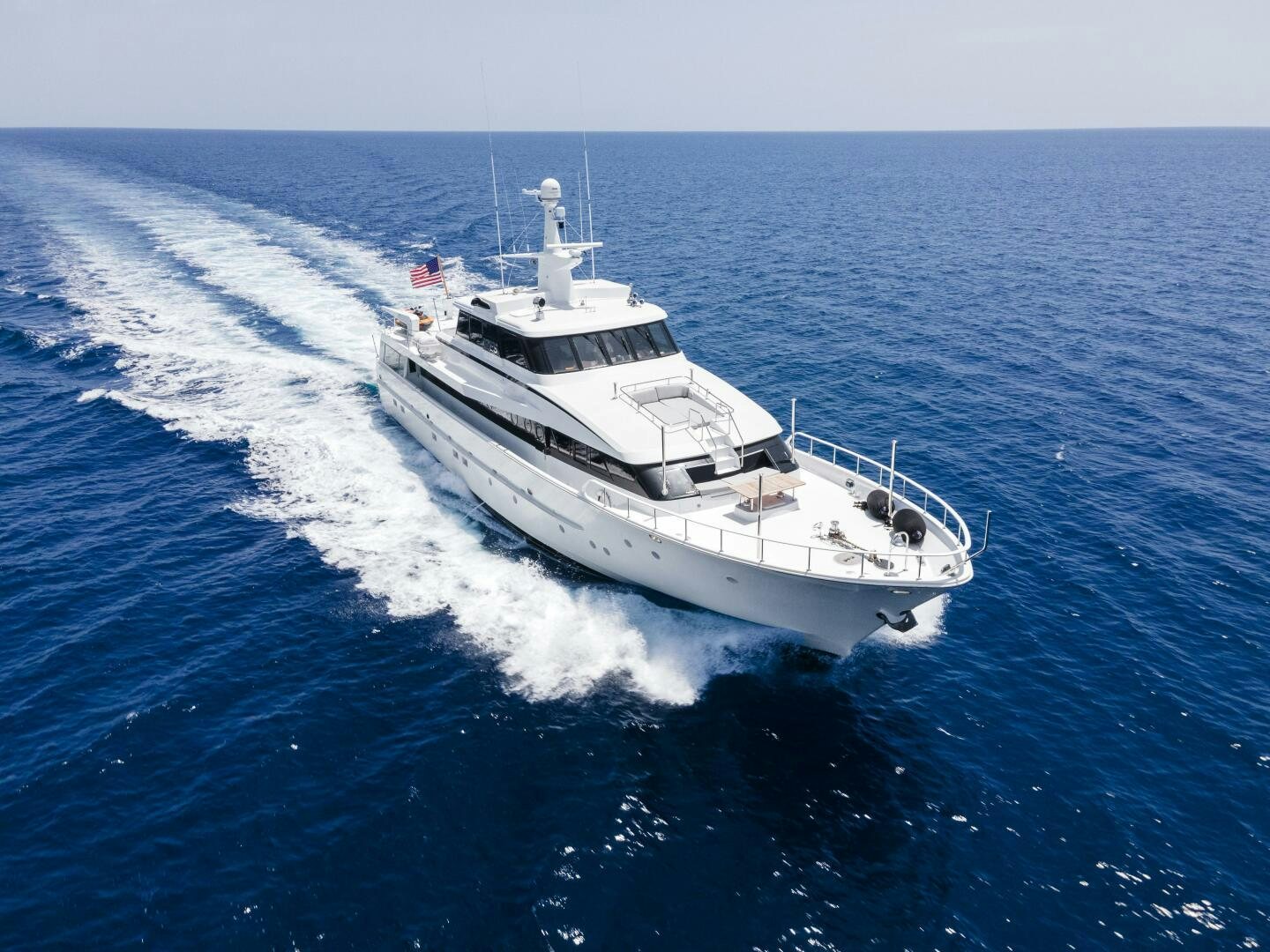 a white boat in the water aboard ARIES Yacht for Sale