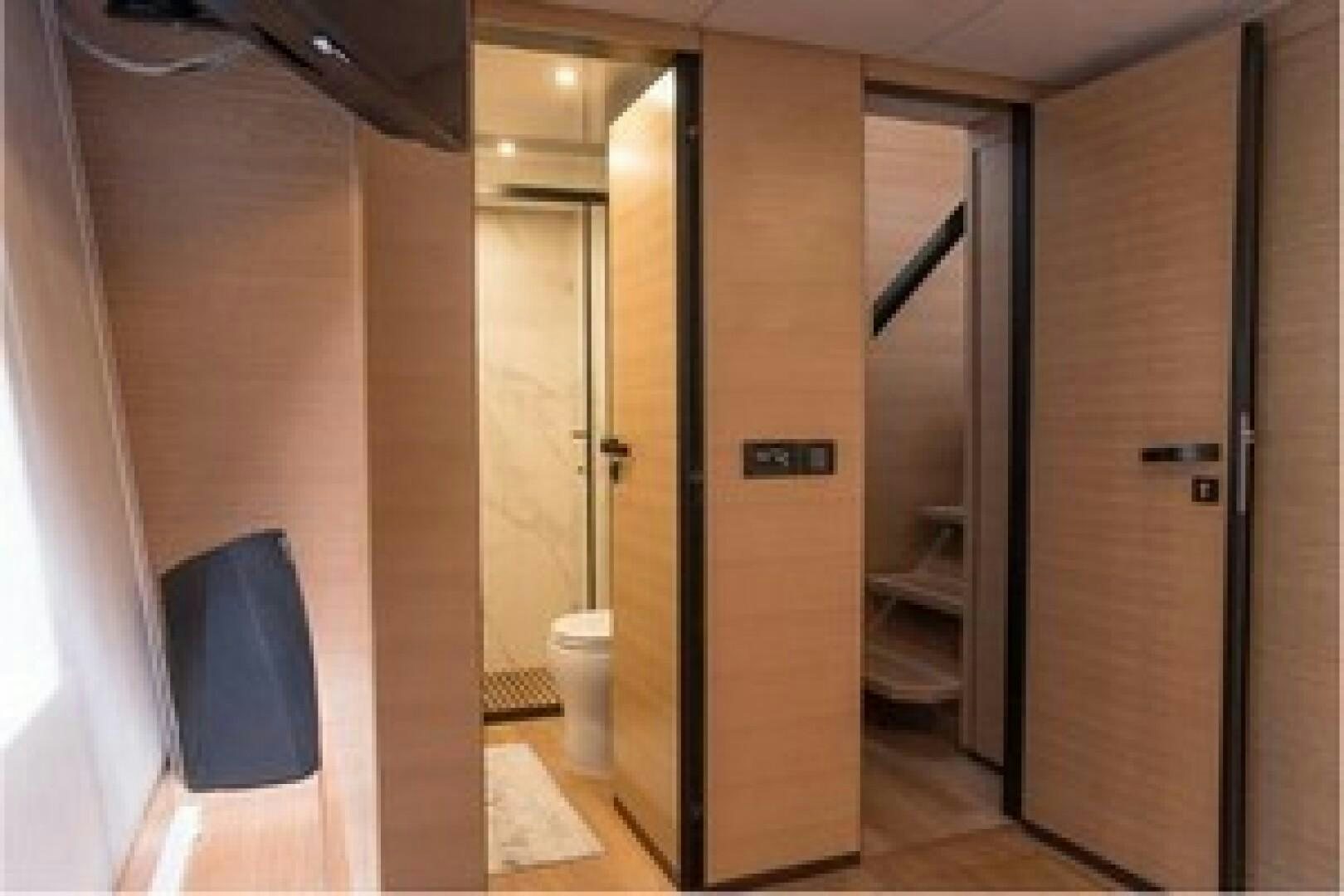 a bathroom with a glass door aboard KAILUA Yacht for Sale