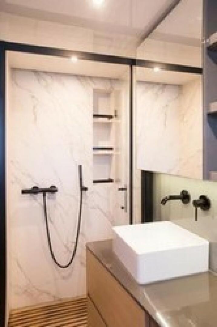 a shower unit with a sink and a mirror aboard KAILUA Yacht for Sale