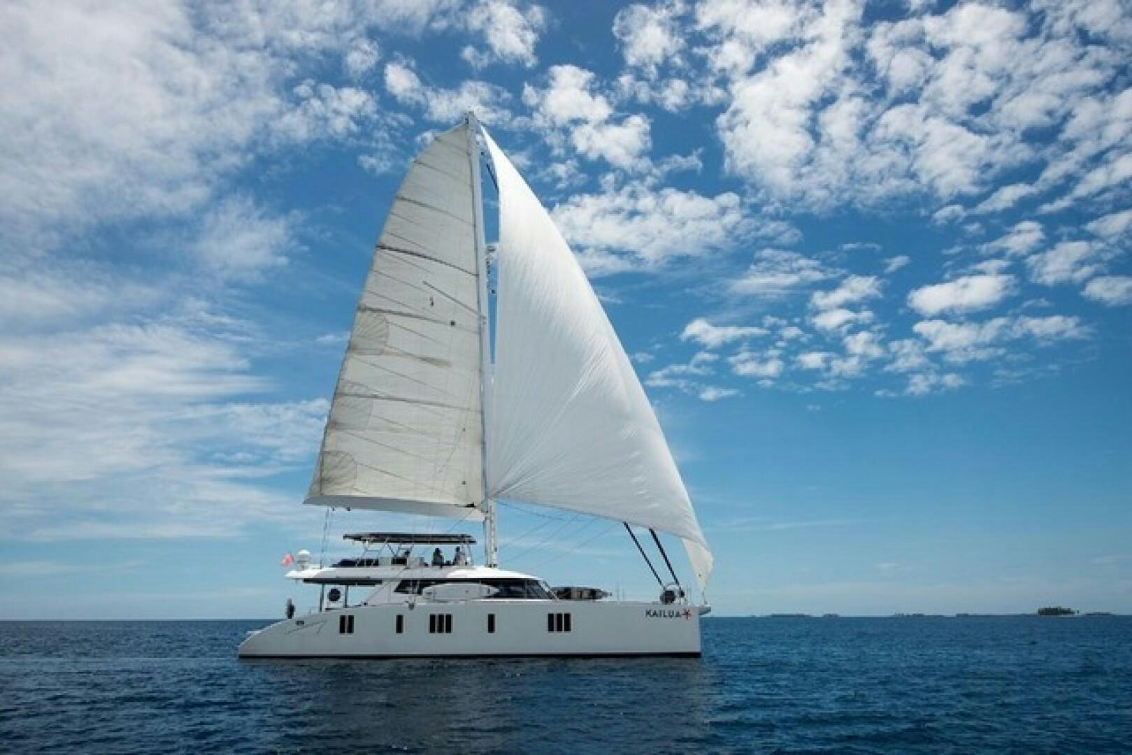 a white sailboat on the water aboard KAILUA Yacht for Sale
