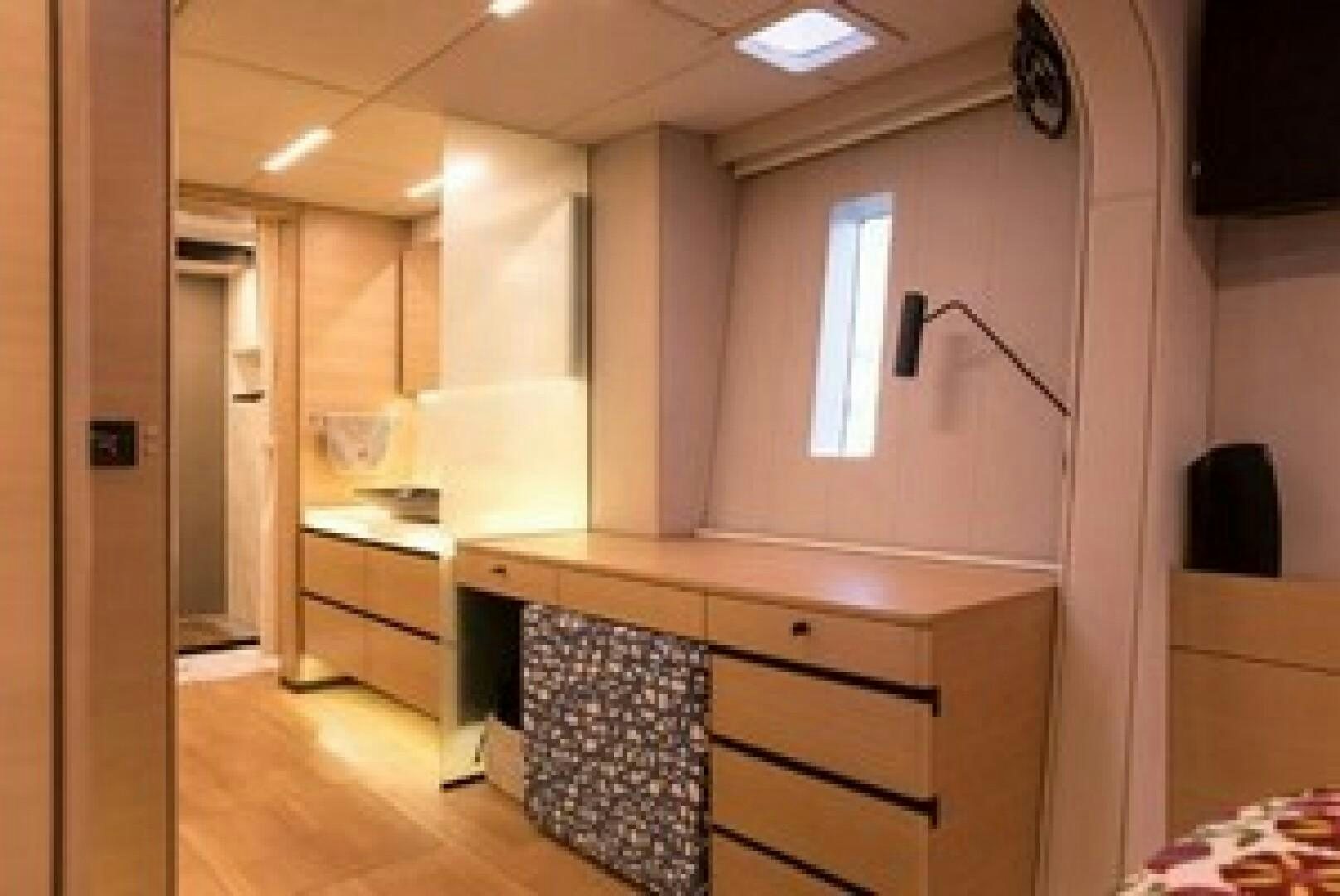 a room with a desk and a chair aboard KAILUA Yacht for Sale