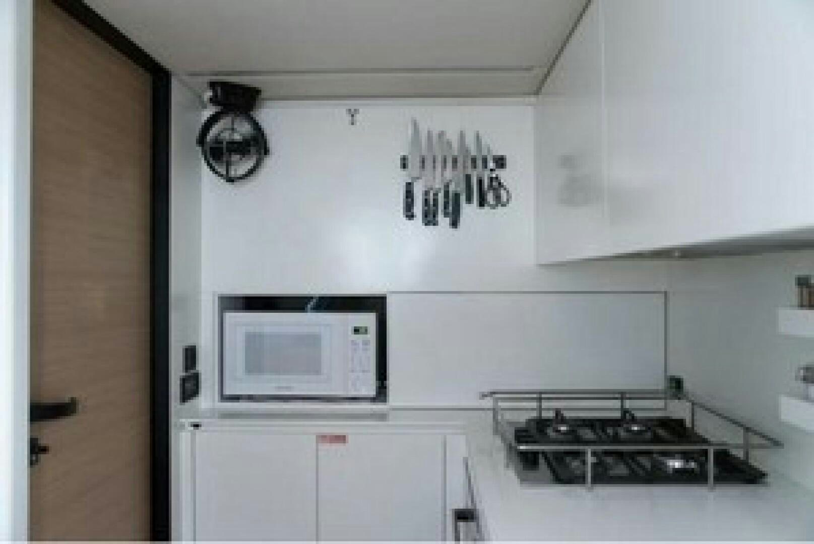 a kitchen with a microwave oven and stove aboard KAILUA Yacht for Sale