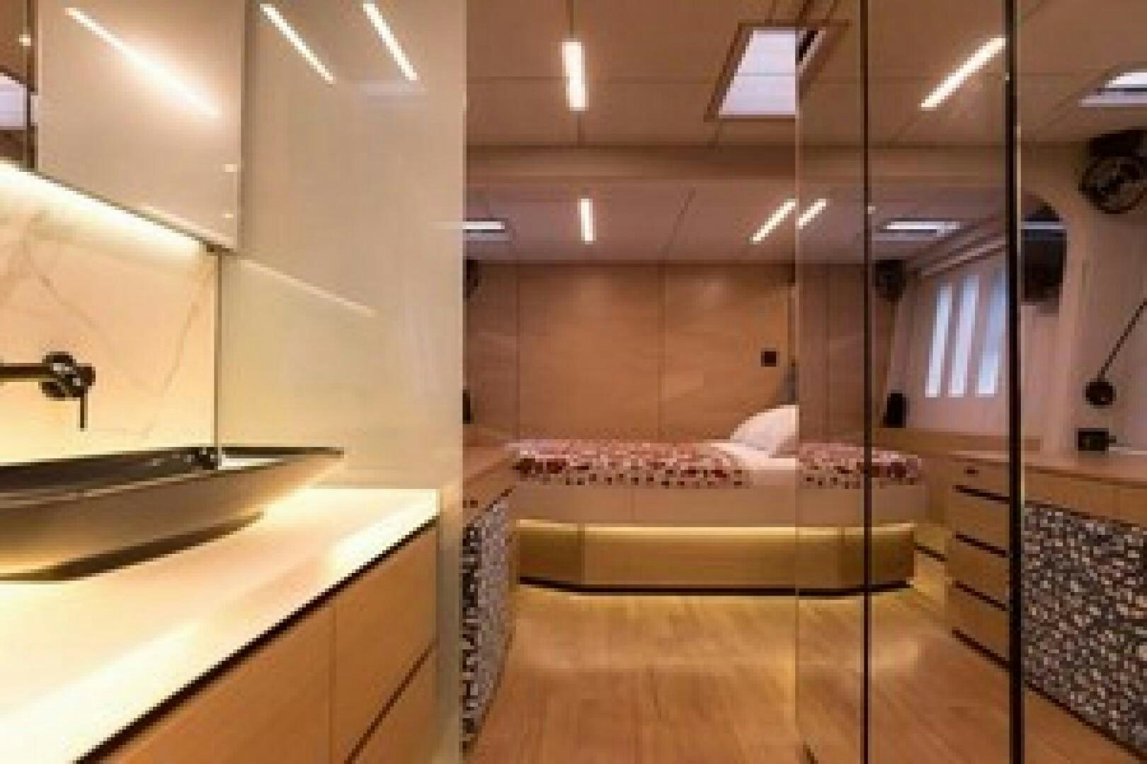 a room with a bed and a sink aboard KAILUA Yacht for Sale