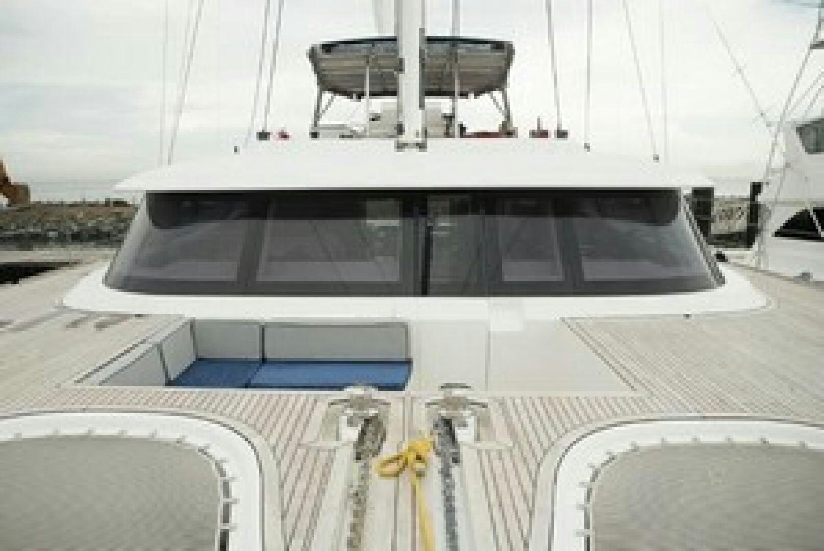 a large white boat with a large white sail on it aboard KAILUA Yacht for Sale