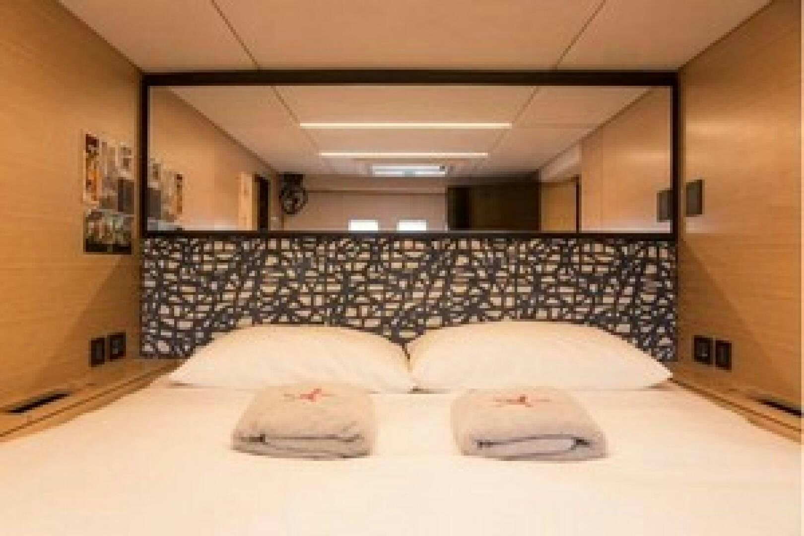 a couple of beds in a room aboard KAILUA Yacht for Sale