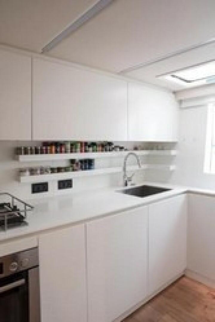 a kitchen with white cabinets aboard KAILUA Yacht for Sale