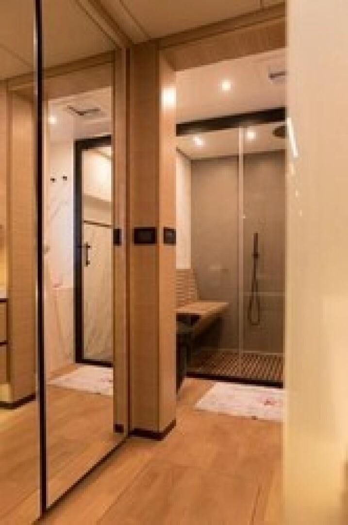 a bathroom with a large mirror aboard KAILUA Yacht for Sale