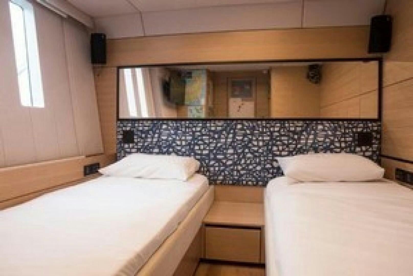 a room with two beds aboard KAILUA Yacht for Sale
