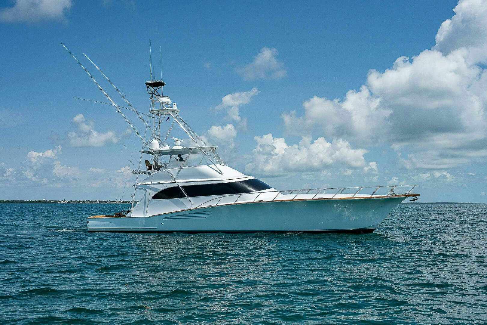 a white boat in the water aboard MAXIMUS Yacht for Sale