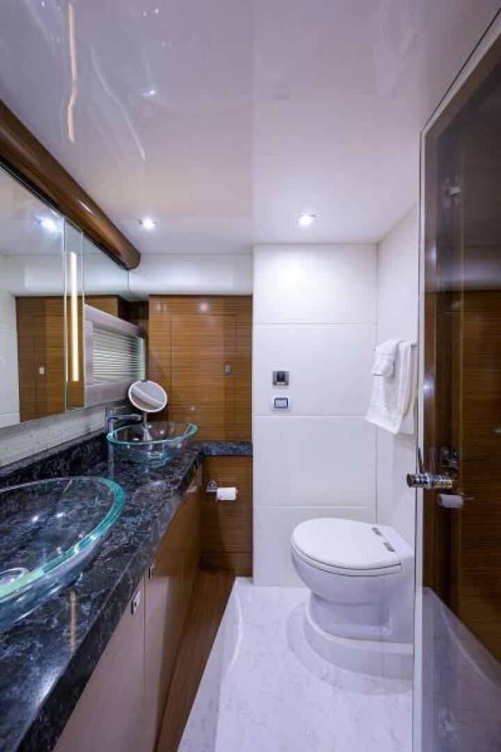 a bathroom with a marble counter top aboard JOHN BOAT Yacht for Sale