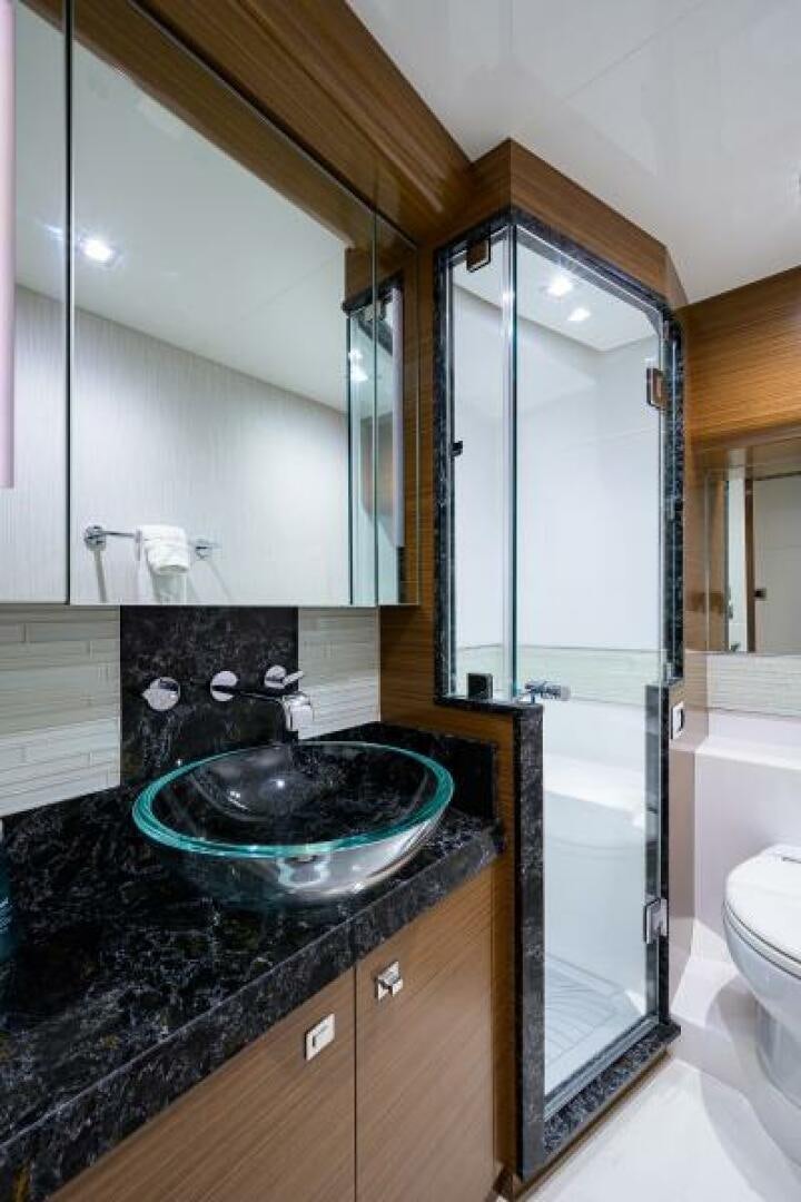 a bathroom with a large mirror aboard JOHN BOAT Yacht for Sale