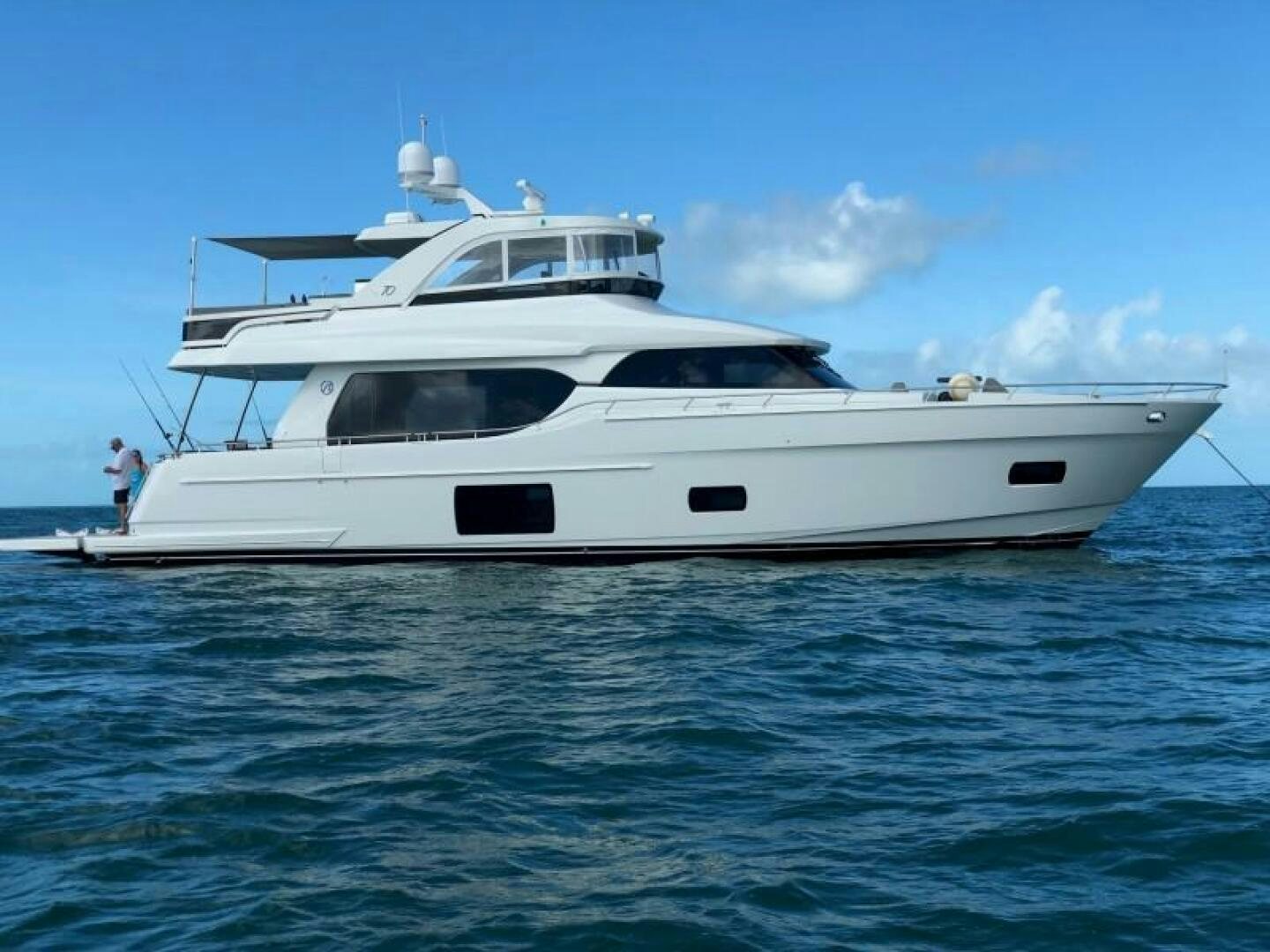 a white yacht in the water aboard JOHN BOAT Yacht for Sale