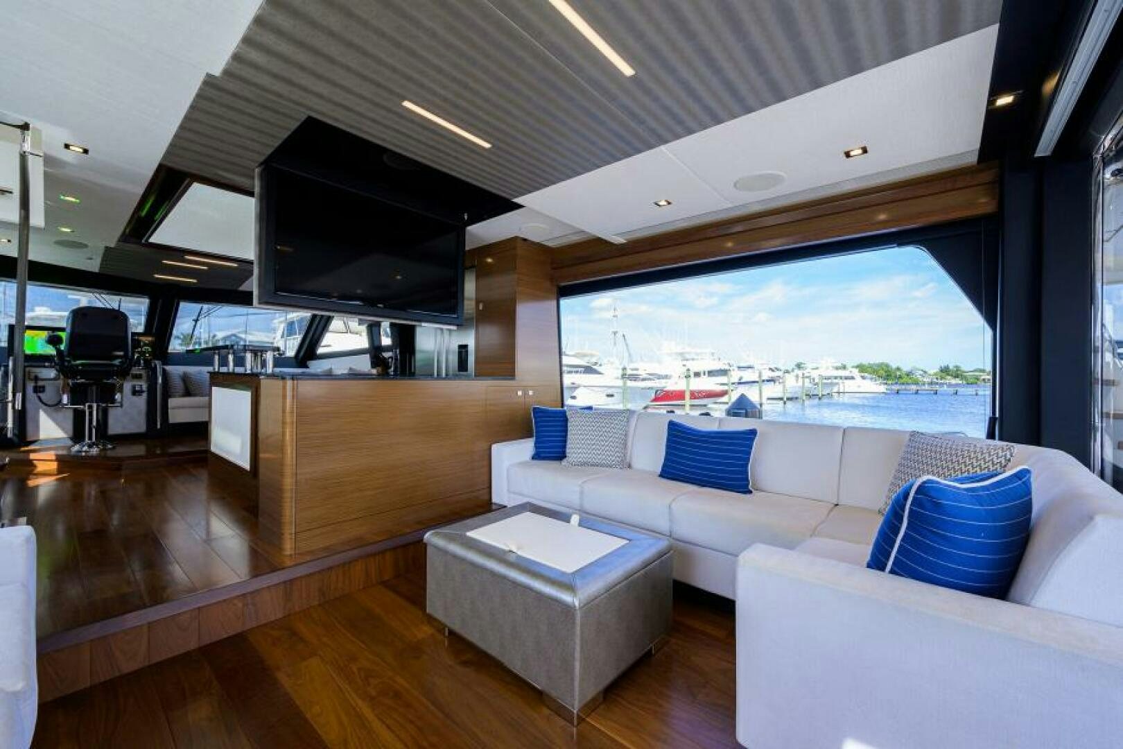 a room with a couch and a television aboard JOHN BOAT Yacht for Sale