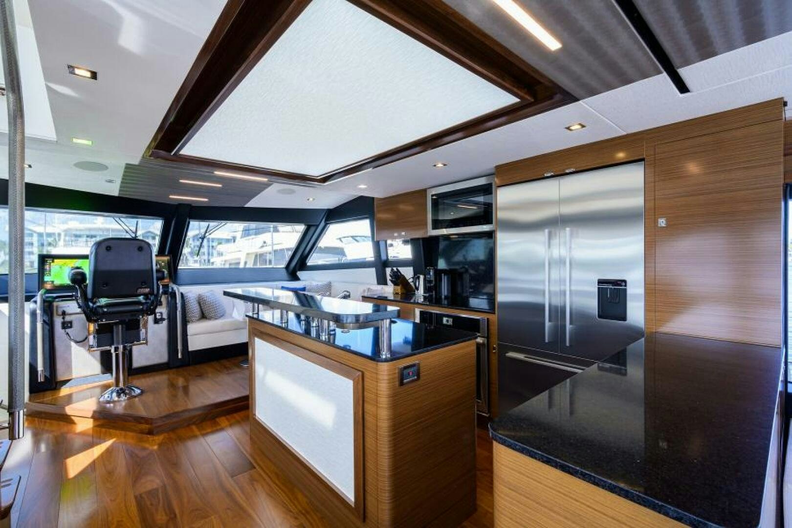 a room with a large glass ceiling aboard JOHN BOAT Yacht for Sale