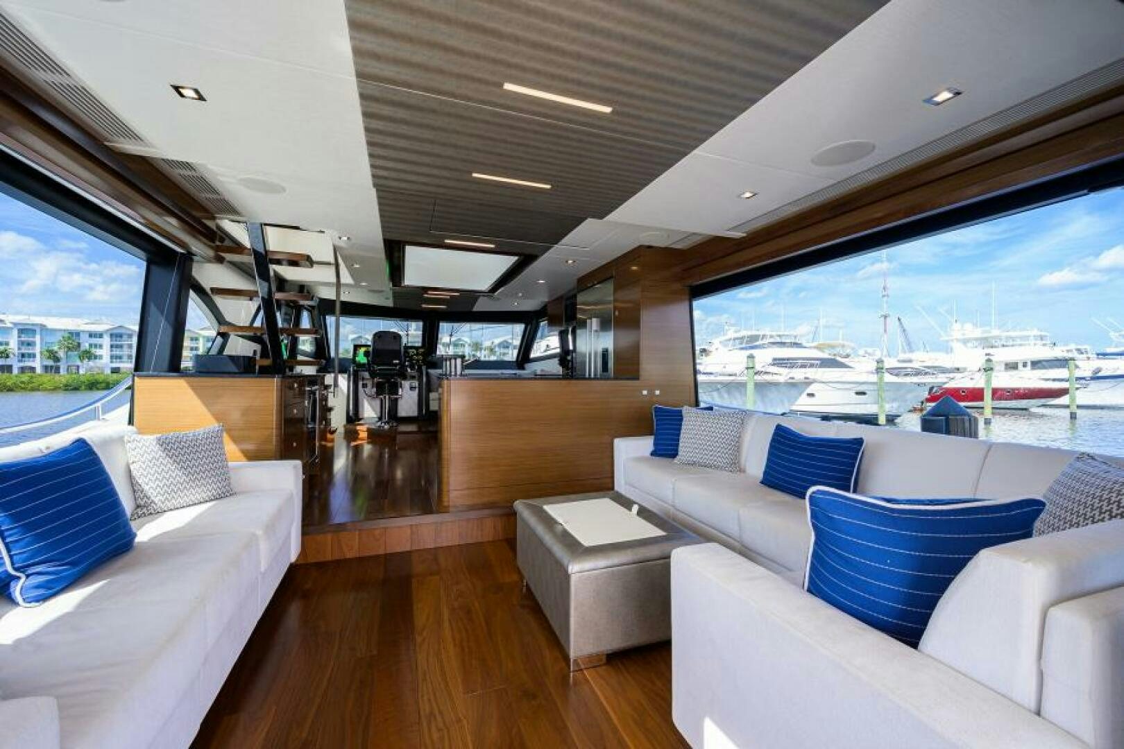 a living room with a large window aboard JOHN BOAT Yacht for Sale