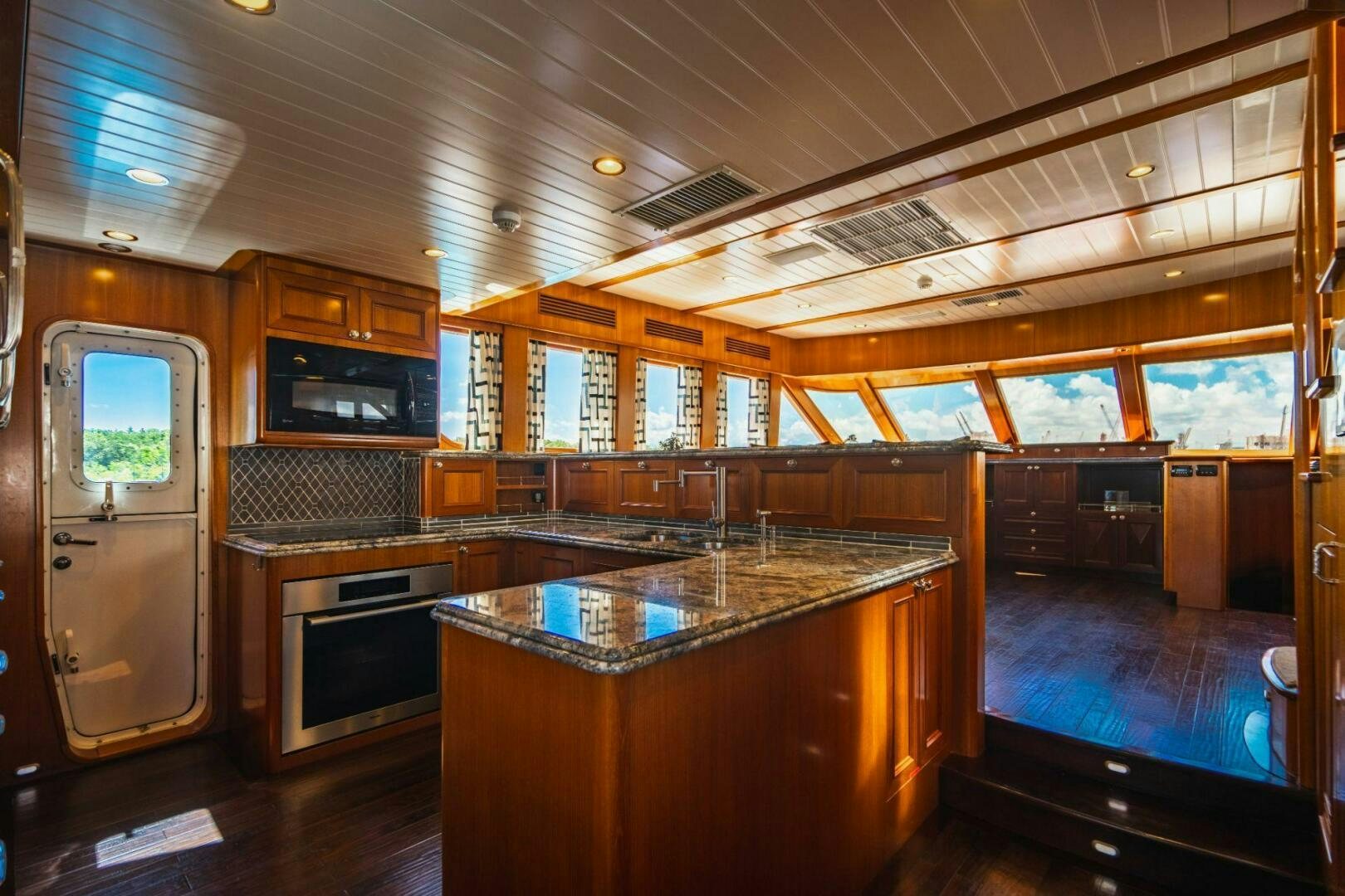a kitchen with a large island aboard MOONSHOT Yacht for Sale