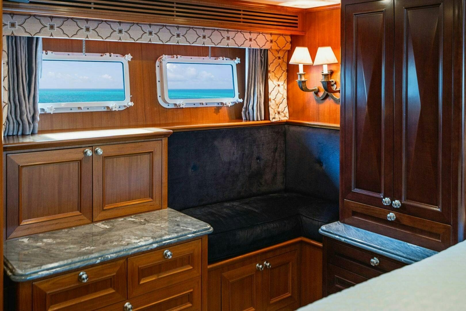 a room with a bed and a television aboard MOONSHOT Yacht for Sale