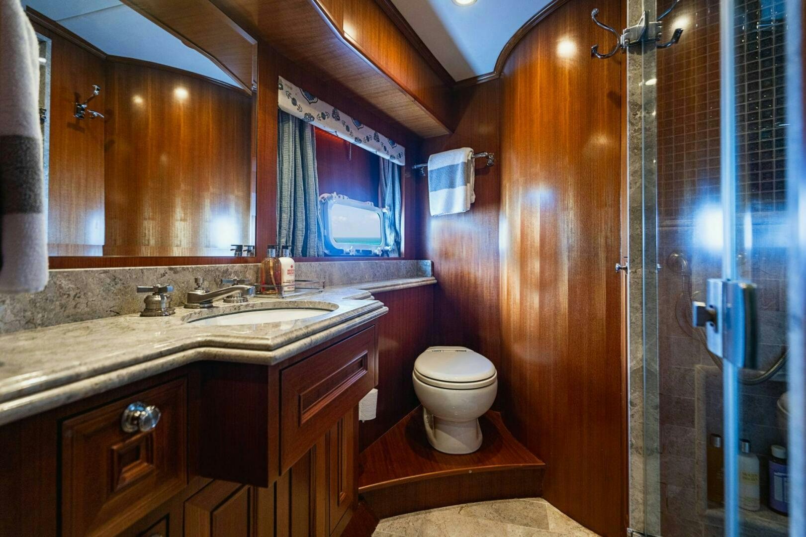 a bathroom with a sink and a toilet aboard MOONSHOT Yacht for Sale