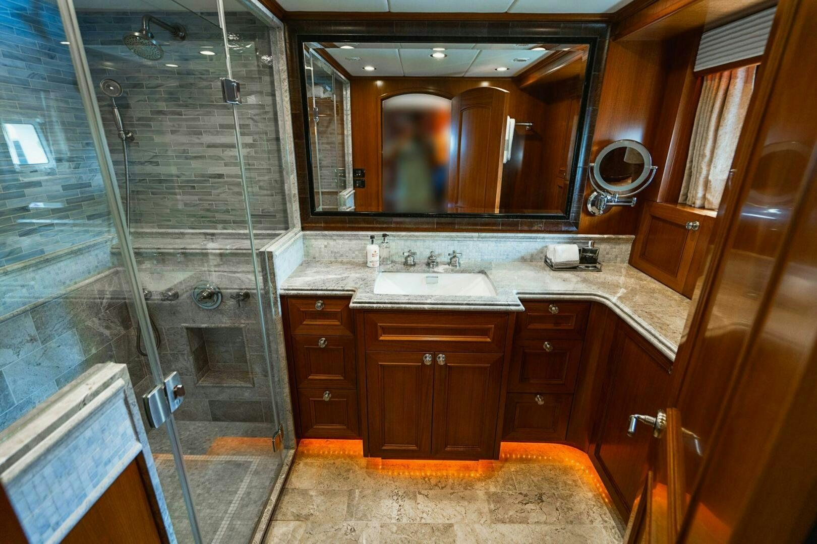 a bathroom with a glass shower aboard MOONSHOT Yacht for Sale
