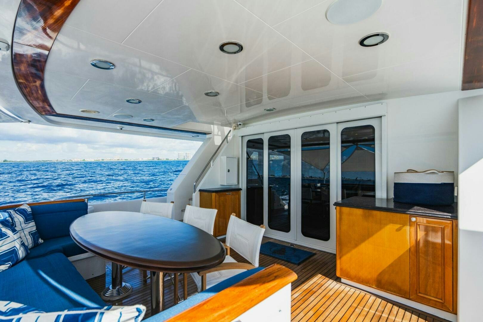 a boat with a table and chairs aboard MOONSHOT Yacht for Sale