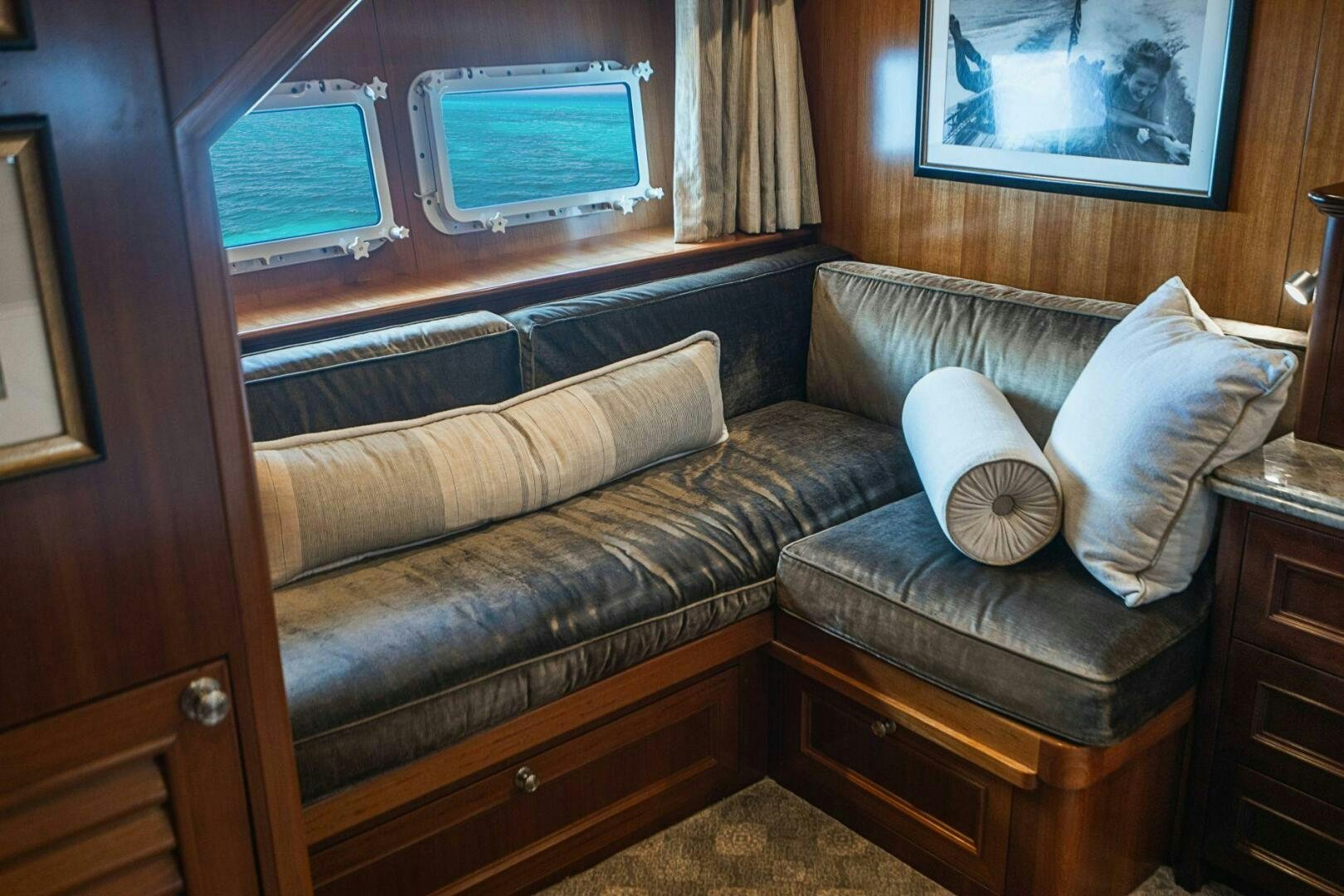 a couch with a pillow on it aboard MOONSHOT Yacht for Sale
