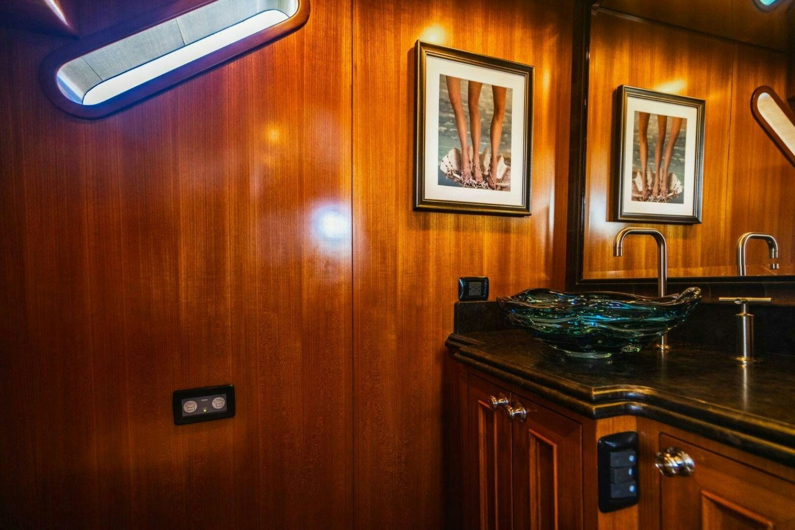 a kitchen with a sink and a mirror aboard MOONSHOT Yacht for Sale