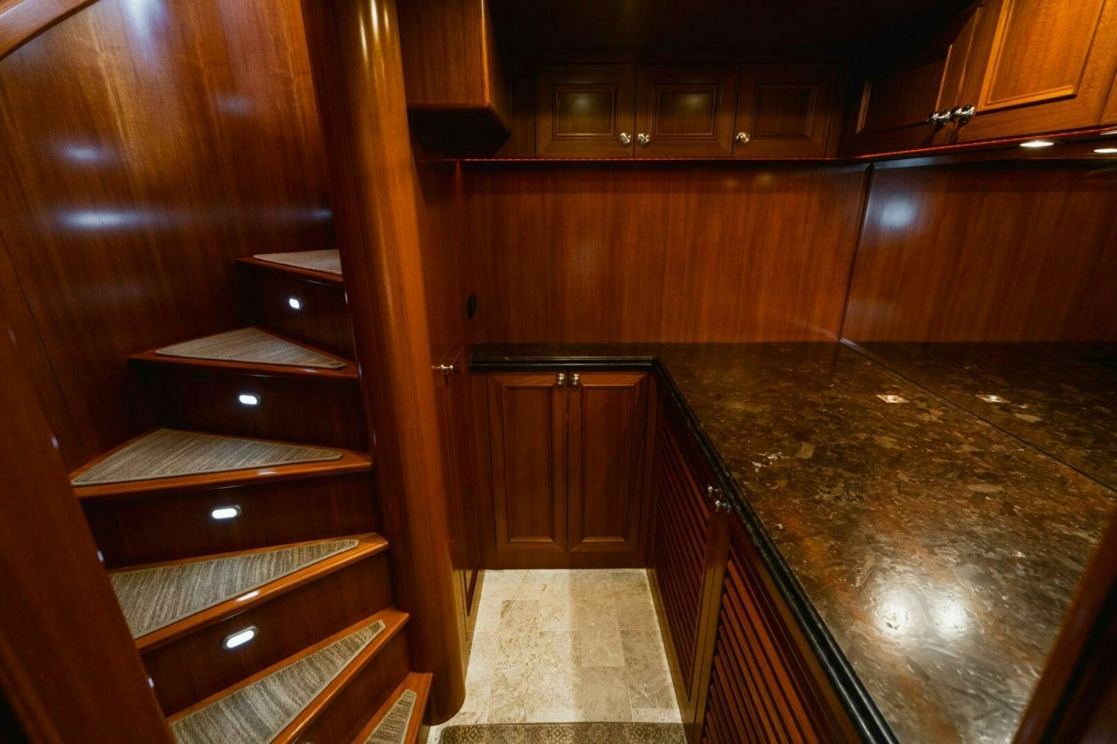 a room with wooden cabinets aboard MOONSHOT Yacht for Sale