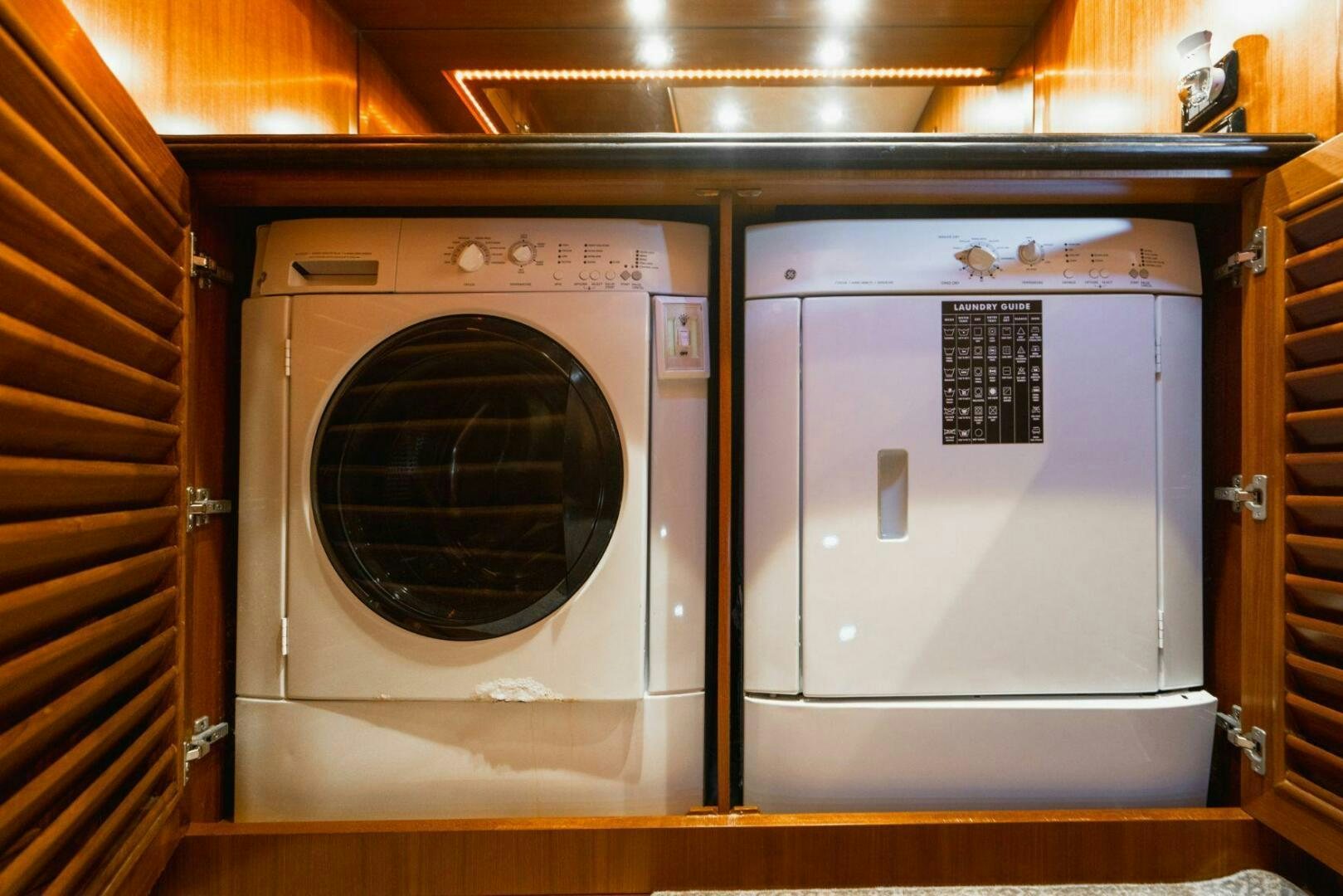 a group of white washing machines aboard MOONSHOT Yacht for Sale