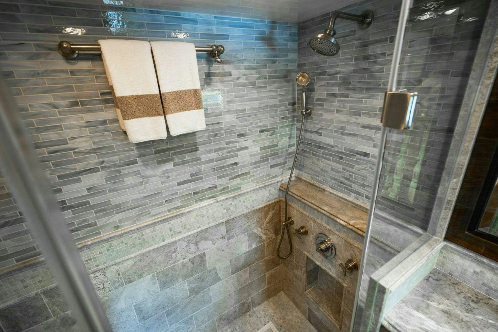 a bathroom with a glass shower aboard MOONSHOT Yacht for Sale